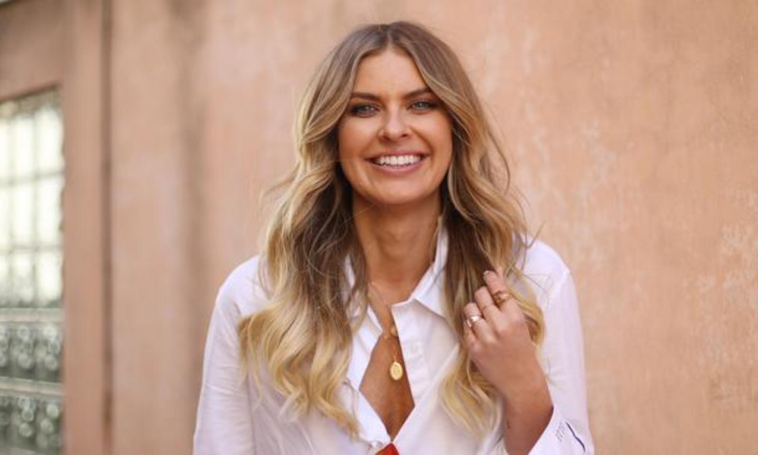 Image of Elle Ferguson smiling, wearing Ultra Violette.