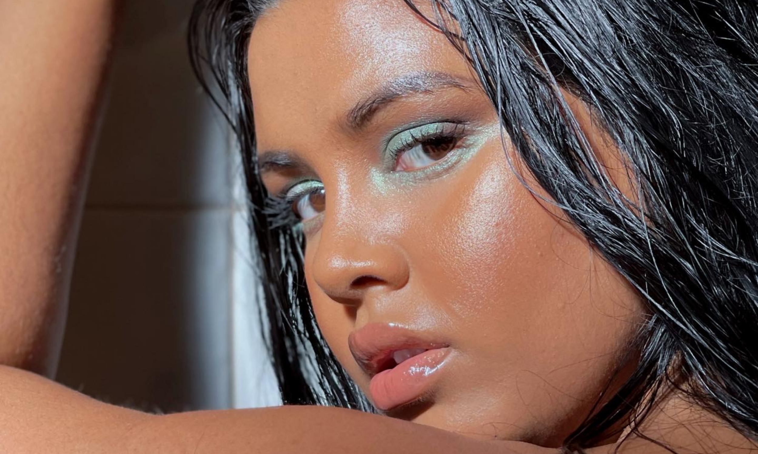Ruchie Page wearing Ultra Violette SPF and blue eyeshadow makeup.