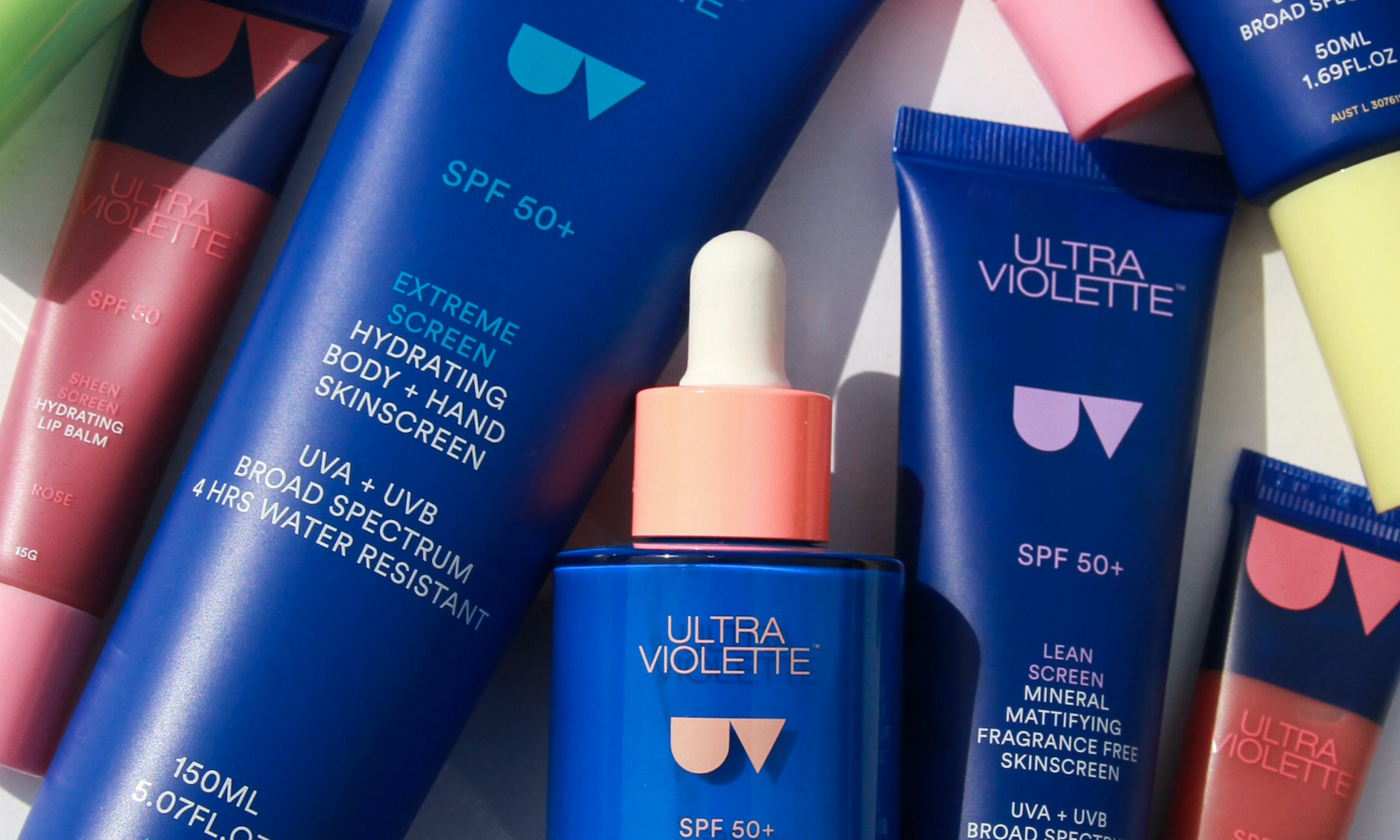 Ultra Violette Products laying down on a table.